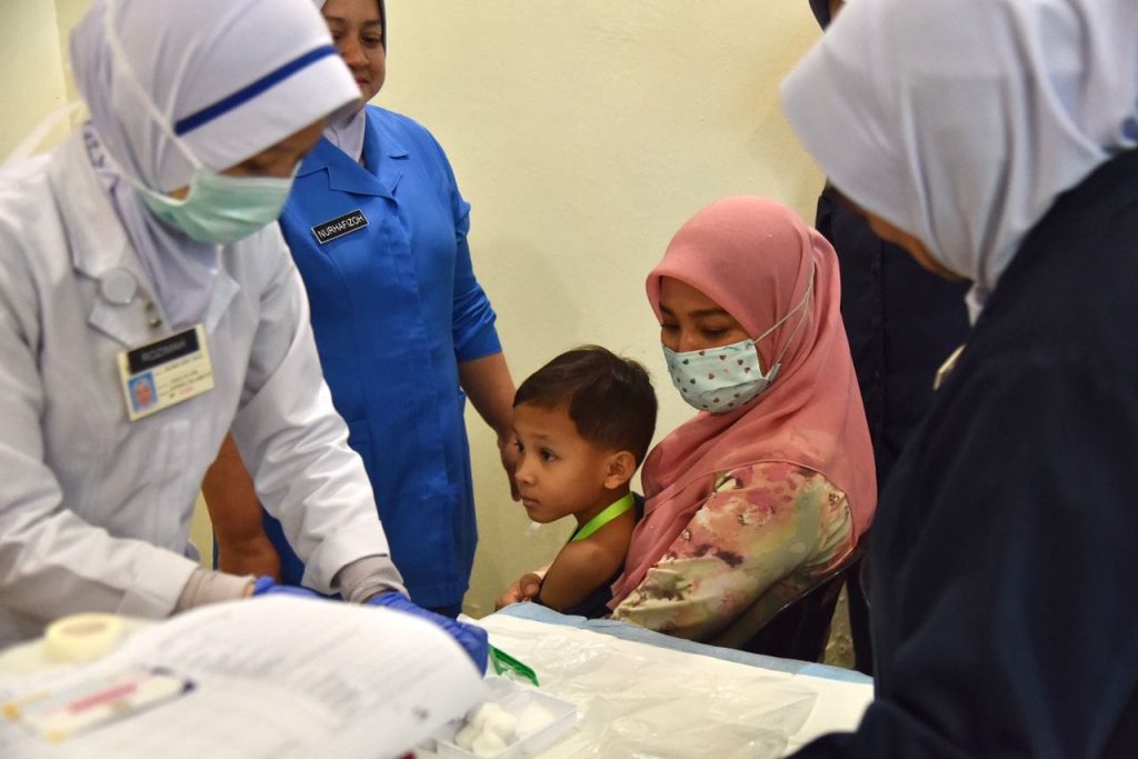 A child gets vaccinated at the National Immunisation Day 2023 celebration in Putrajaya on May 31, 2023. The Ministry of Health also kicked off the Catch-Up Pneumococcal Vaccination Programme (CHUPP) on June 1, 2023. Photo from Ministry of Health's Facebook page.