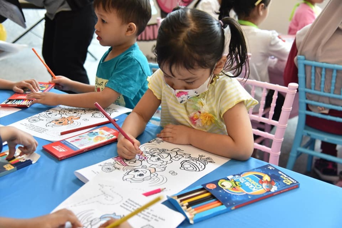 Young children colouring during the Ministry of Health's National Immunisation Day 2023 celebration in Putrajaya on May 31, 2023. Photo from the Ministry of Health's Facebook page.